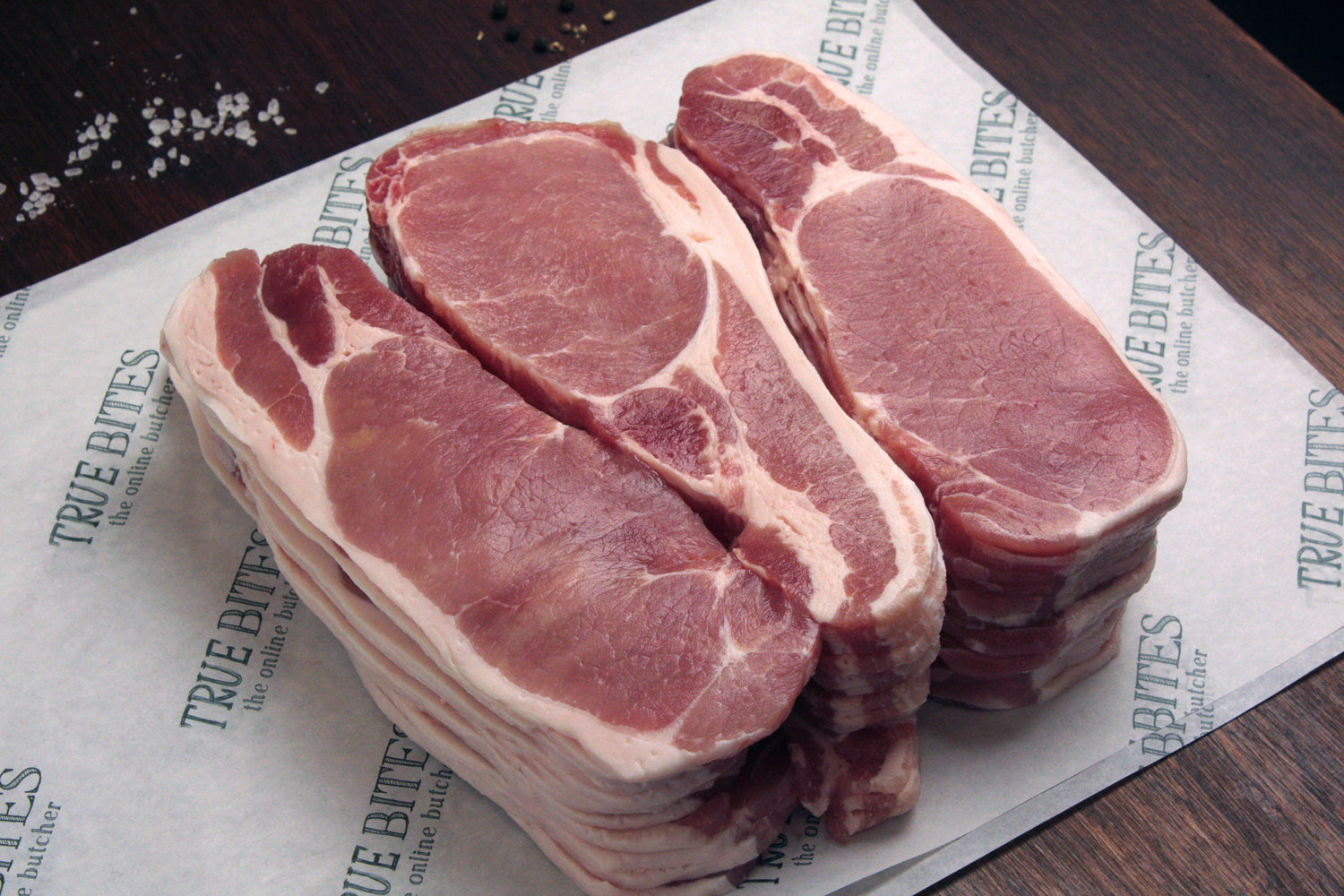 2.27KG of rindless back bacon placed on true bites branded greaseproof paper
