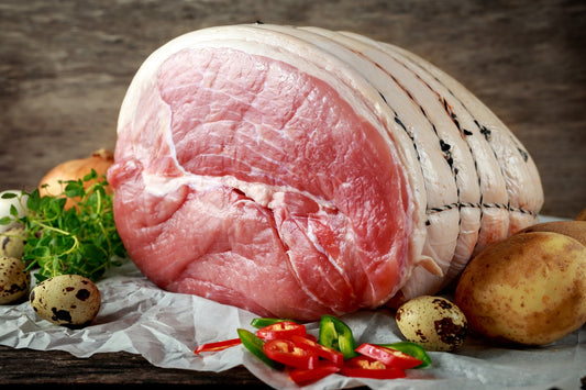 raw smoked gammon joint on greaseproof paper
