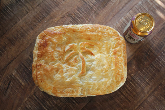 pork and ginger beer pie photographed next to a can of old jamaica ginger beer