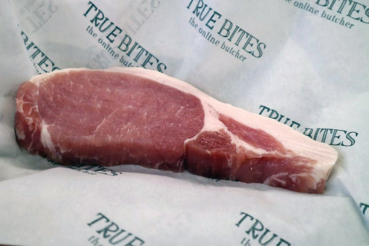 bacon chop displayed on true bites greaseproof paper