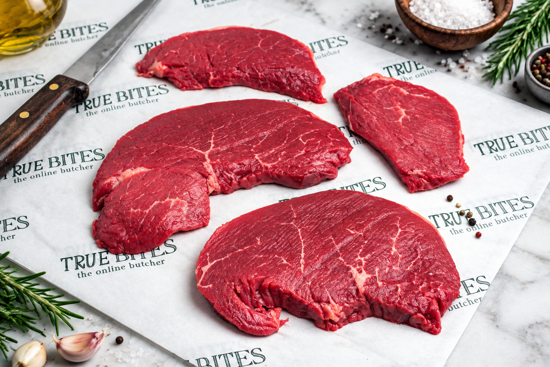 raw lean braising steak on greaseproof paper