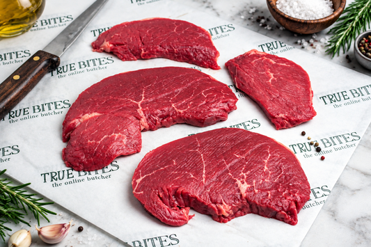 raw lean braising steak on greaseproof paper