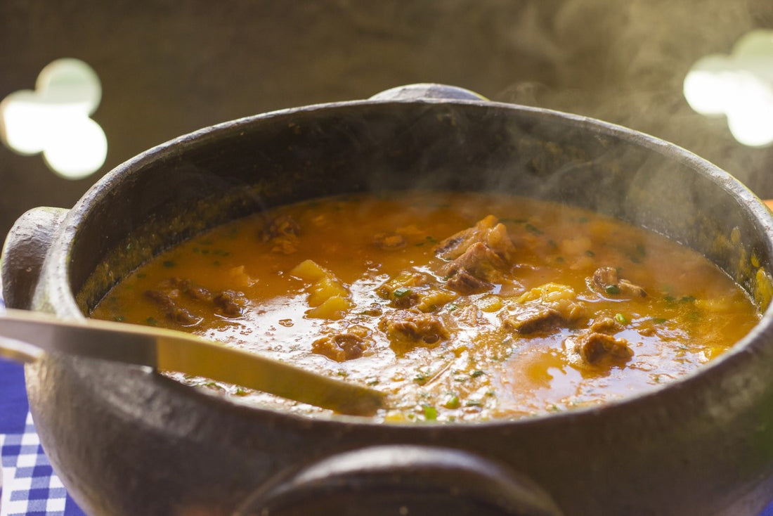 bowl of piping hot soup on a table 