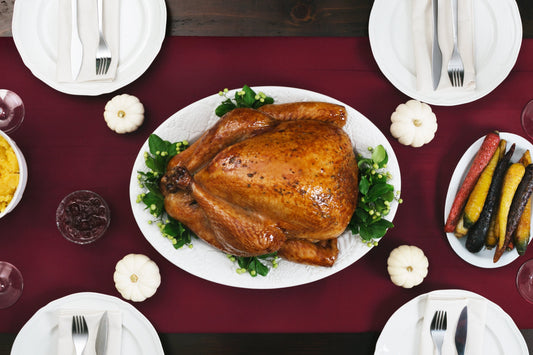 whole roasted turkey in the centre of a table