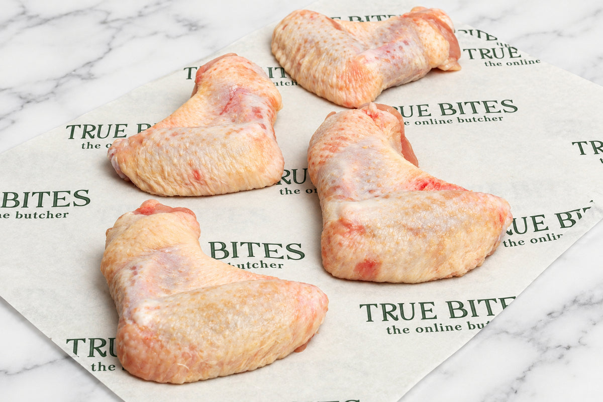 4 two joint chicken wings on branded true bites butcher paper