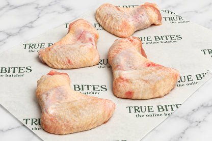 4 two joint chicken wings on branded true bites butcher paper