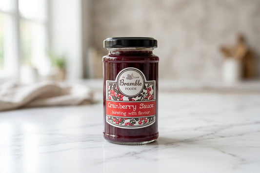 A jar of Bramble Foods Cranberry Sauce sits on a white countertop.