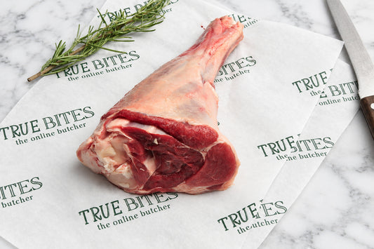 raw lamb shank of branded true bites butcher paper