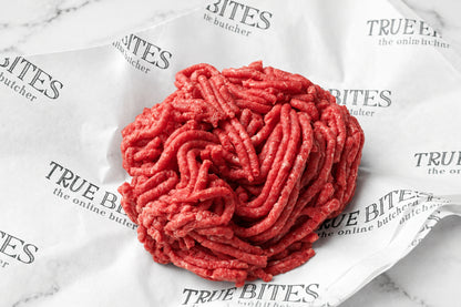 raw lean beef mince on branded true bites butcher paper