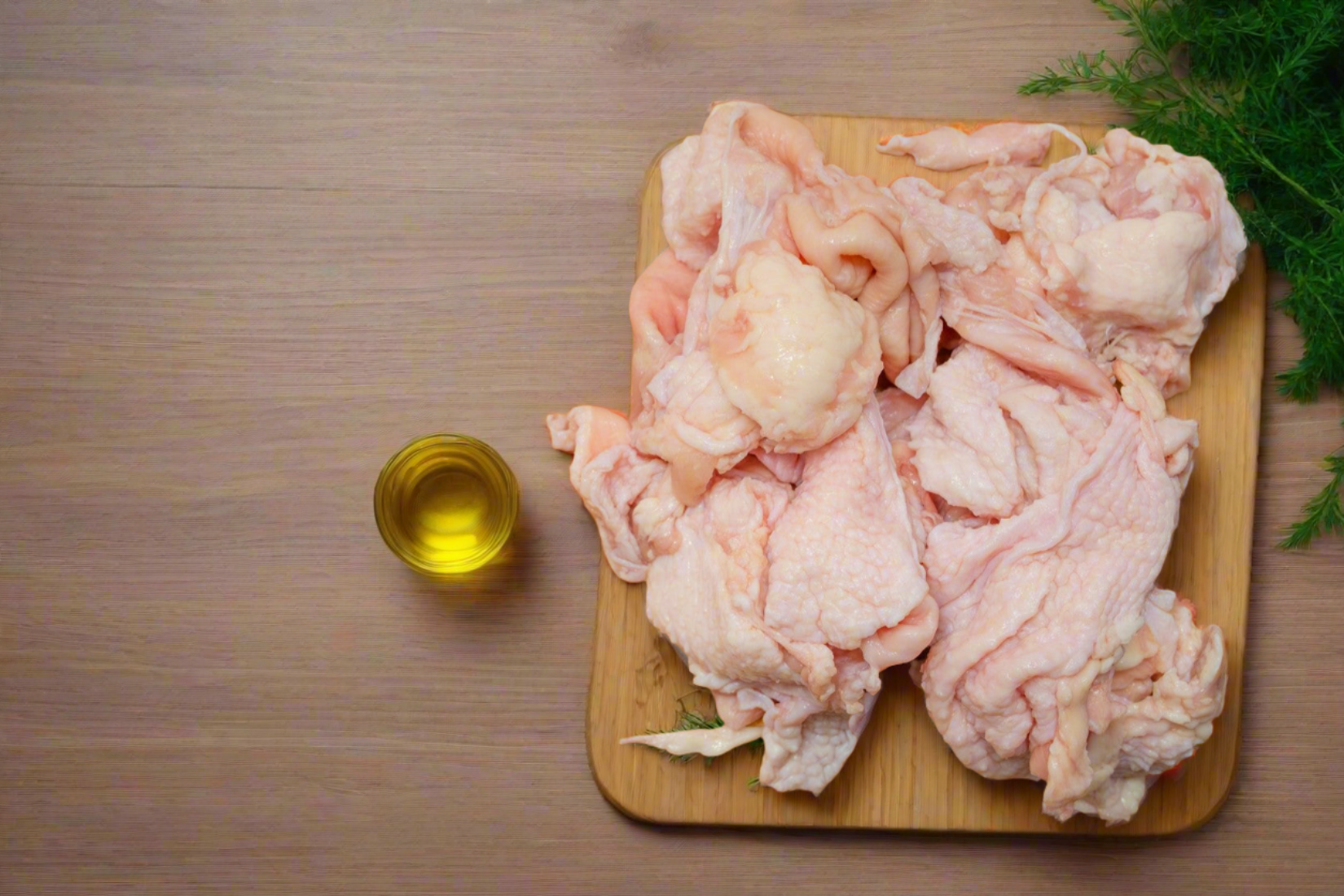 raw chicken skin on a chopping board