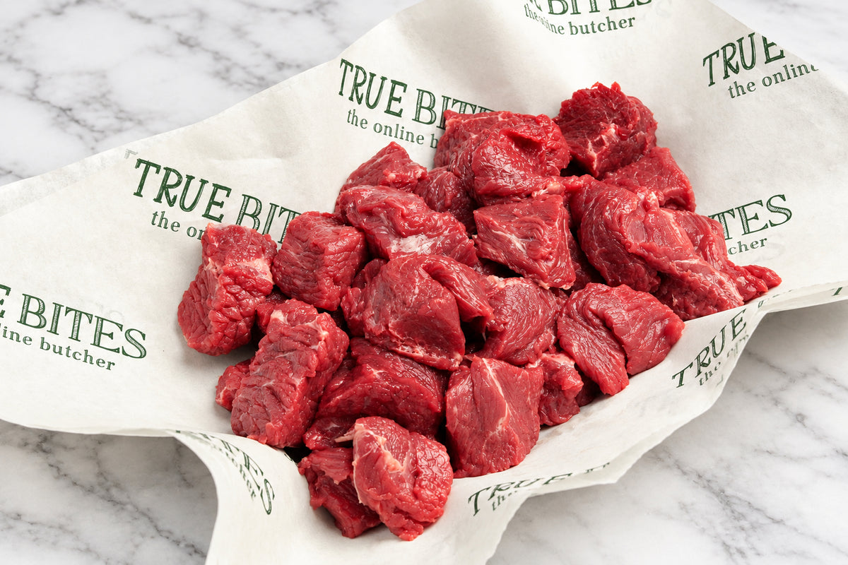 raw diced beef steak displayed in branded true bites butcher paper