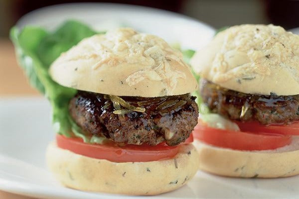 2 cooked lamb burgers on a plate