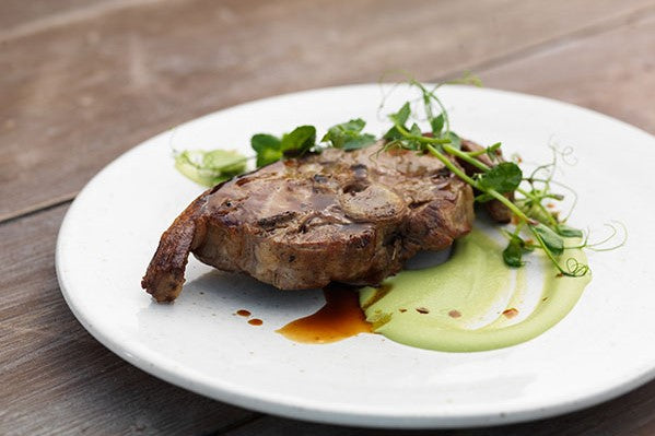 roasted Barnsley lamb chop on a white plate