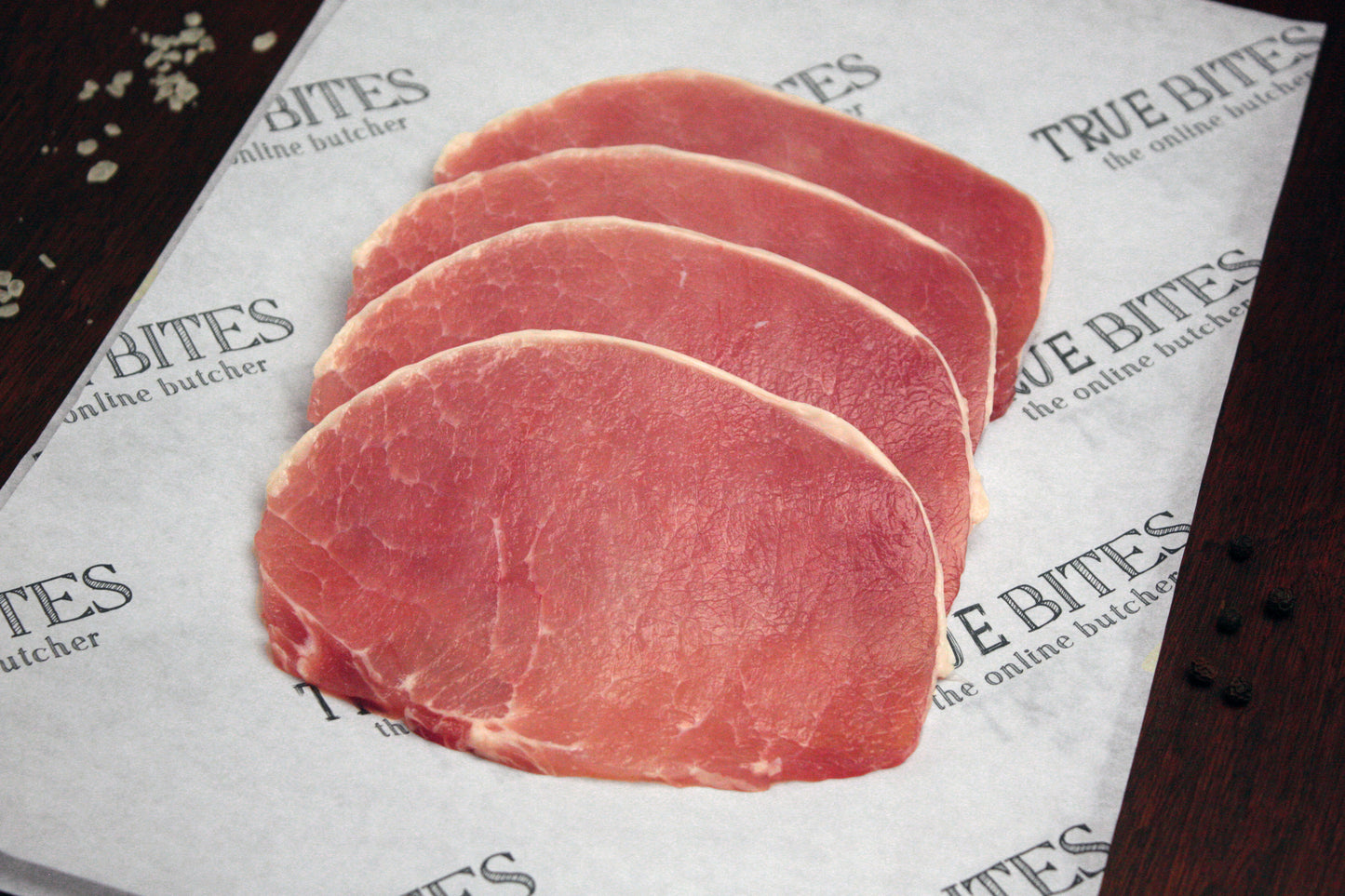bacon medallions displayed on true bites branded greaseproof paper