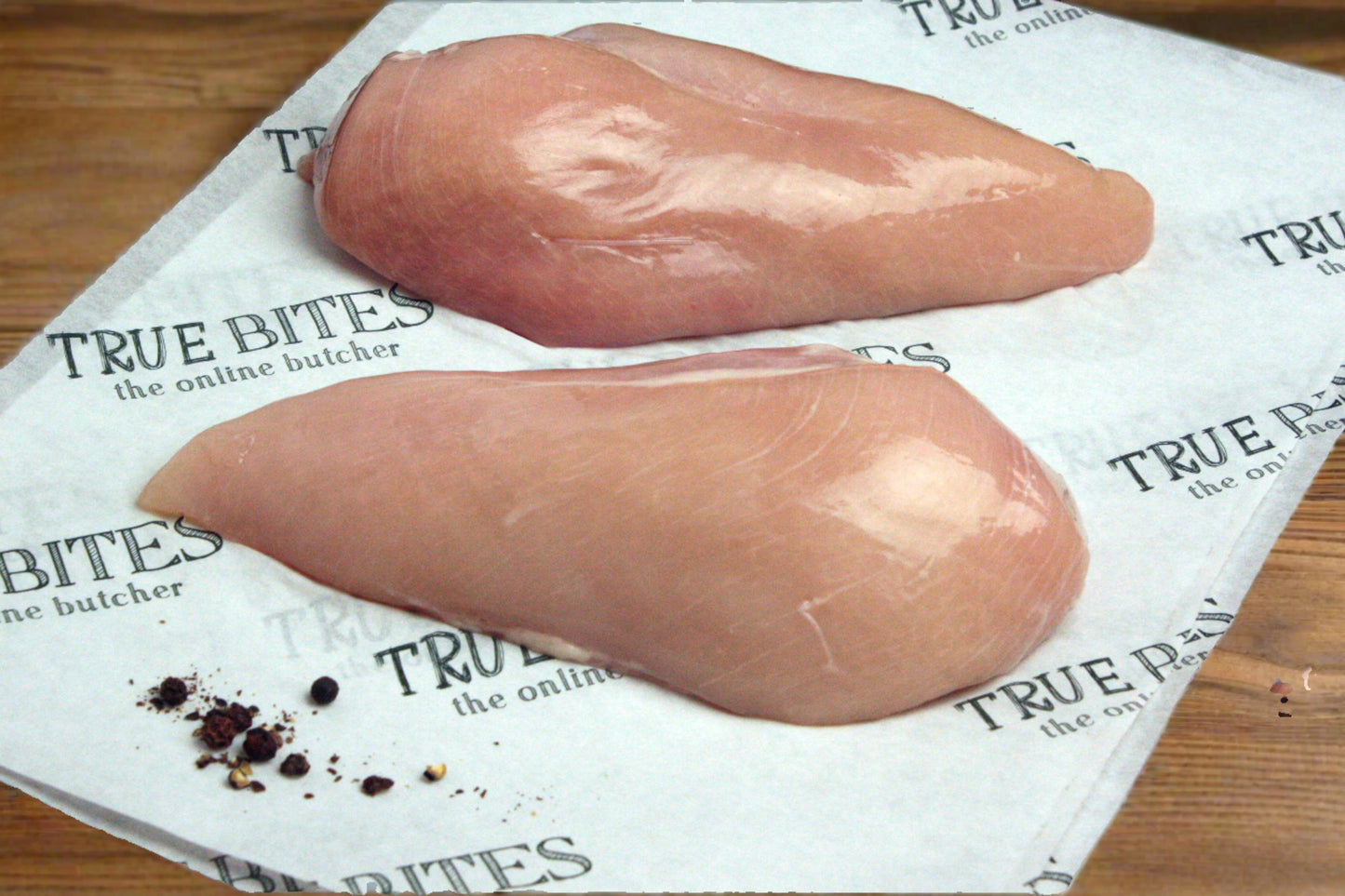 2 raw chicken breasts on true bites greaseproof paper