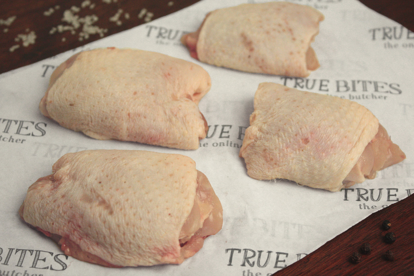 boneless chicken thighs on true bites greaseproof paper