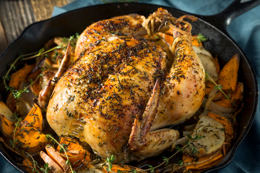 whole roasted chicken in a skillet