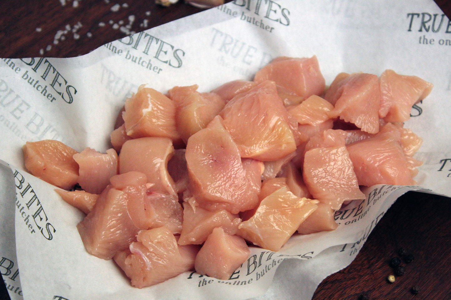 diced chicken breast on true bites greaseproof paper