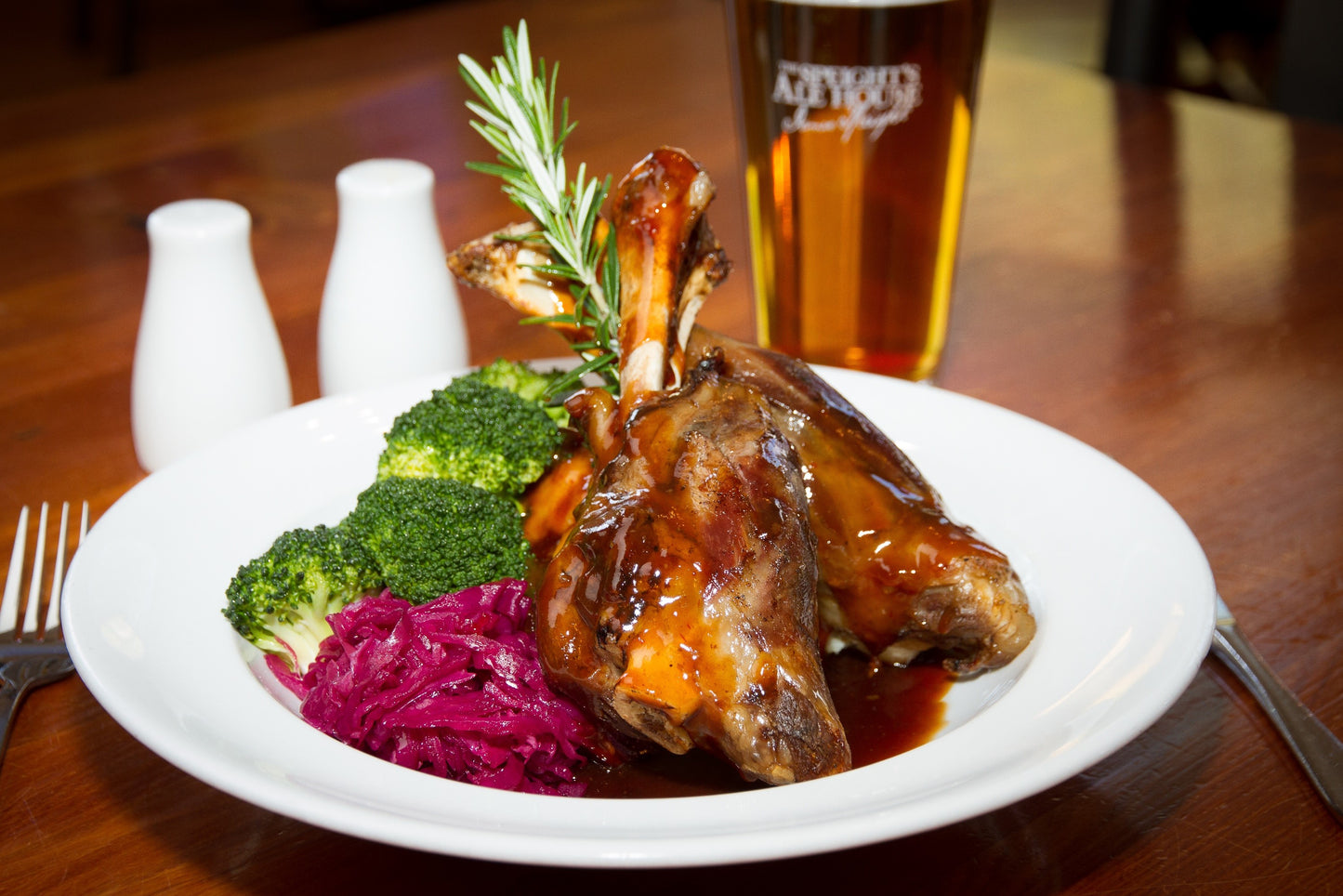 slow cooked lamb shank served with cabbage and brocolli 