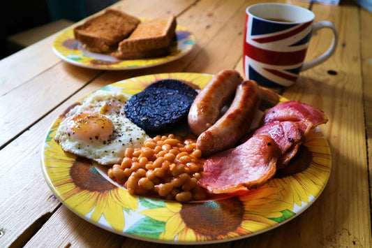 bacon, sausage, black pudding, egg and beans on a plate 