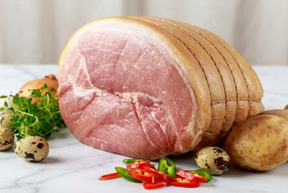 raw smoked gammon joint on greaseproof paper