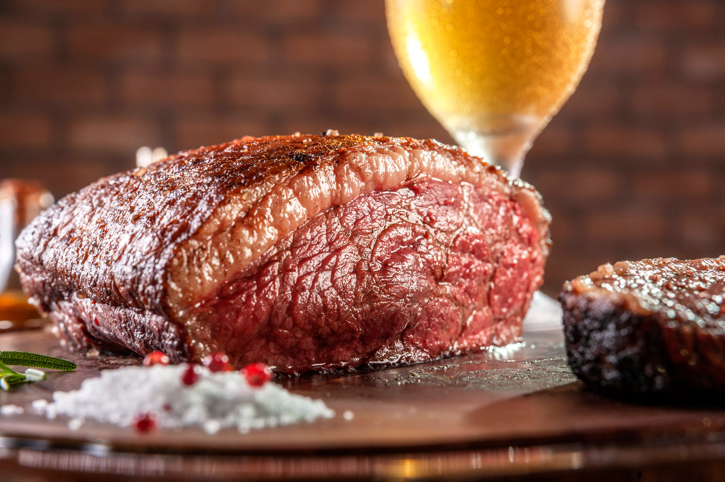 roasted beef rump cap displayed with salt and pepper