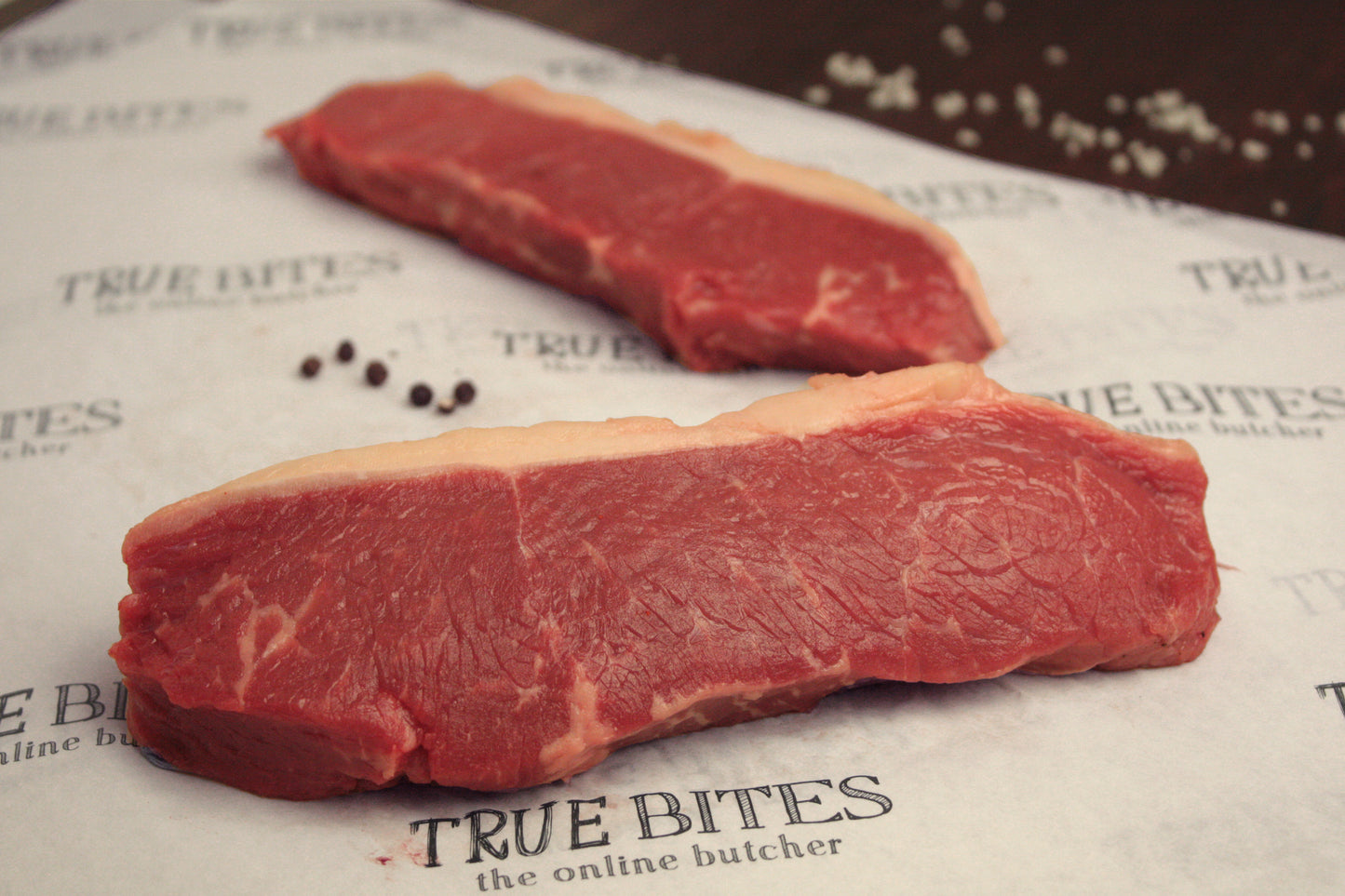 2 beef sirloin steaks pictured on true bites branded greaseproof paper