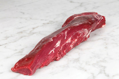 whole boneless British beef fillet on w white surface