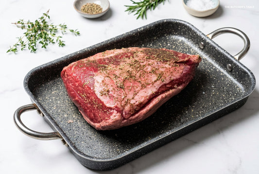 whole raw beef rump cap on roasting tray fat side down ready for oven