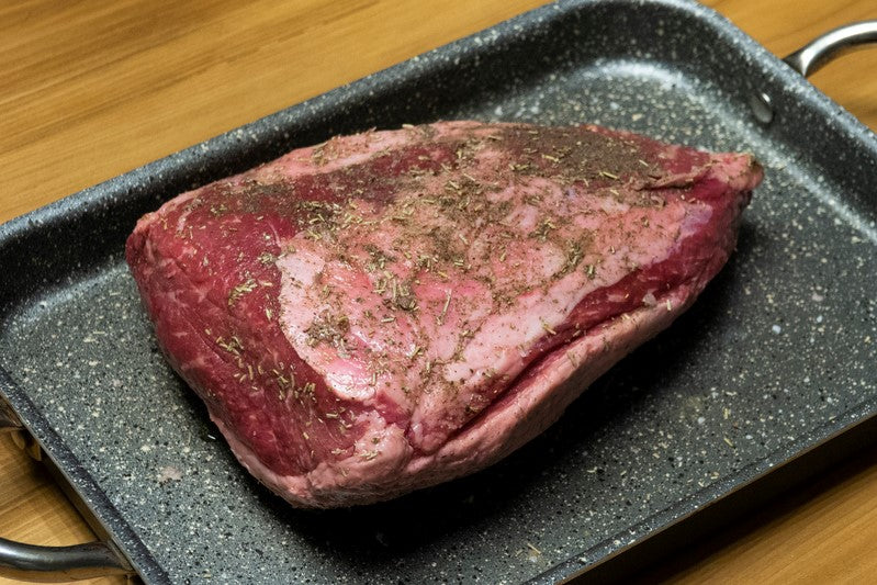 whole raw beef rump cap on roasting tray ready for oven